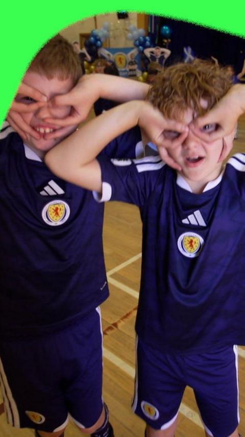 Children do John McGinn's celebration at his old school