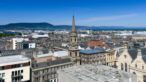 A view across Inverness city centre towards the Kessock Bridge and the Black Isle on a beautiful sunny day.