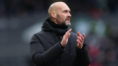 Luke Williams claps during Swansea's game with West Brom earlier this month