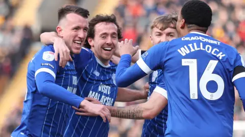 David Turnbull (left) celebrates his goal for Cardiff