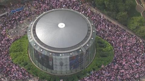 An aerial shot showing large crowds of protestors near to Waterloo Bridge and the Imax cinema in central London.