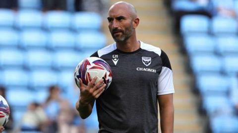 Oxford United coach Chris Hackett during the pre-match warm-up prior to the Championship match between Coventry City FC and Oxford United