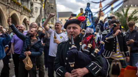 Scotland fans at Euro 2024 - a Tartan party in Munich with bagpipes and partying