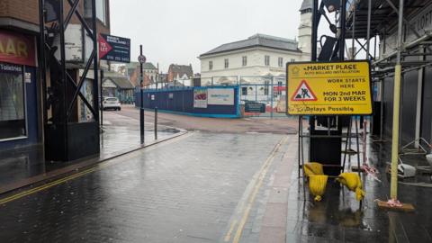 A sign informing that work is beginning on March 2 in front of Market Place
