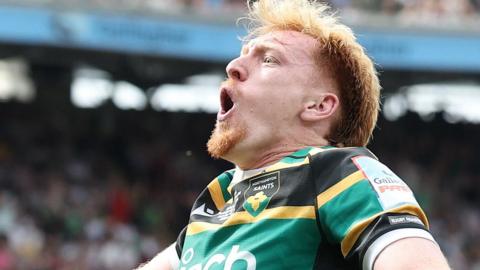 George Hendy celebrates scoring a try