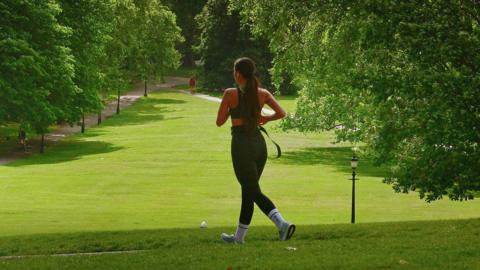 A woman jogging in a park