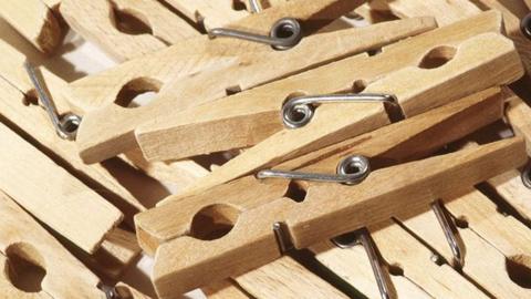 Close up image of wooden clothes pegs