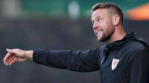 Chris Gunter gives instructions from the touchline