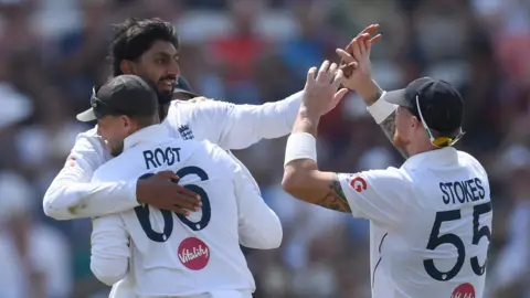England players celebrate a wicket