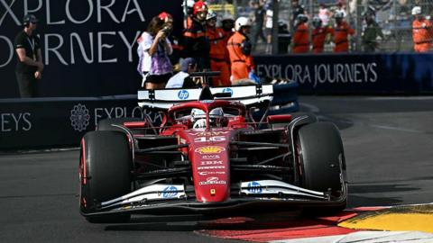 Ferrari's Charles Leclerc rides a kerb while going through a chicane in Monaco Grand Prix second practice