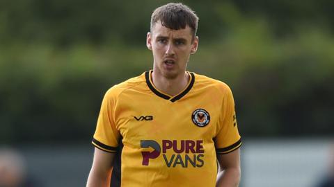 Newport player Ciaran Brennan in action