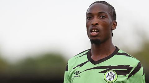 Laurent Mendy in Forest Green's lime green and black kit