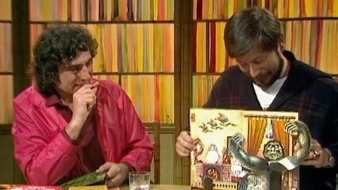 Jan Pienkowski demonstrates his pop-up book to Terry Jones.