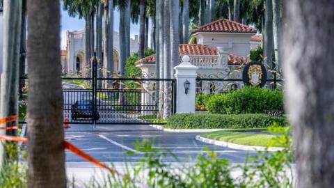 Police tape is seen in front of a golf club