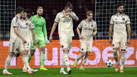 Ajax players look disappointed after conceding against Benfica 