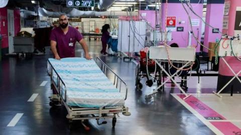 A medical professional pushes a hospital bed at an emergency hospital in Haifa, northern Israel