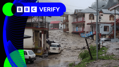 Flood water sweeps through the town of Dharali, northern India
