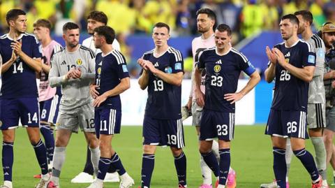 Players look rejected after losing 3-0 to Brazil 