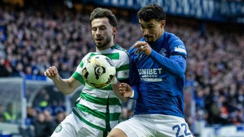 Celtic's Nicolas Kuhn (left) and Rangers' Jefte in action during a Premiership match between Rangers and Celtic at Ibrox