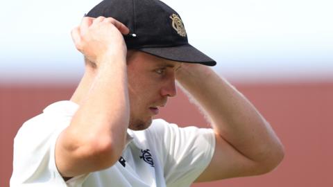 Cameron Green adjusts his cap in the field
