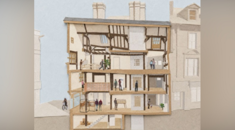 A side-on plan of a timber framed building with the walls removed so you can see inside, with a number of people shown inside the building