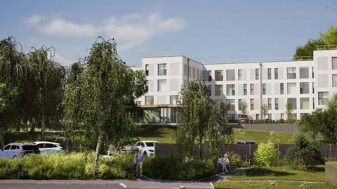 An architect's drawing of the new staff accommodation. It is white with many large windows and a flat roof. In the foreground is a car park with willow trees, hedges and grass. 