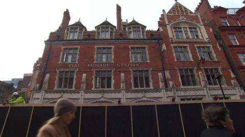 Chiltern Firehouse with a black barrier round it 