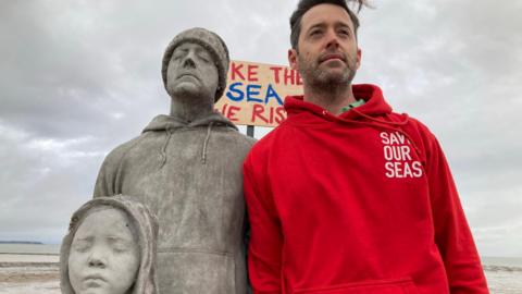 Robin Bartlett with some of the Sirens statues at Whitstable