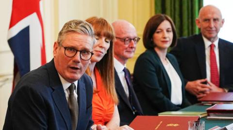 An image of Keir Starmer sitting at a table with other members of his Cabinet