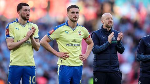 Southampton players applaud the fans after losing to Manchester City at Wembley