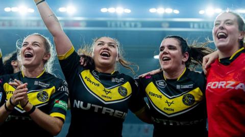 Eboni Partington, Sade Rihari and Carrie Roberts celebrate victory over Leeds.