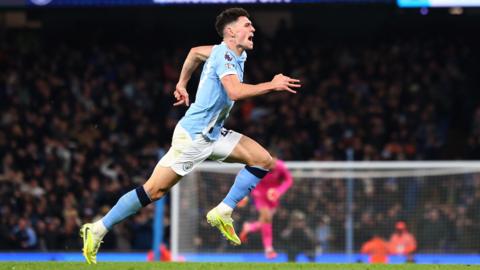 Phil Foden of Manchester City celebrates after he score