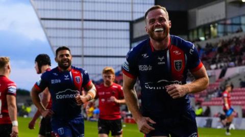Hull Kingston Rovers winger Joe Burgess celebrates a try against Salford Red Devils with teammate Peta Hiku