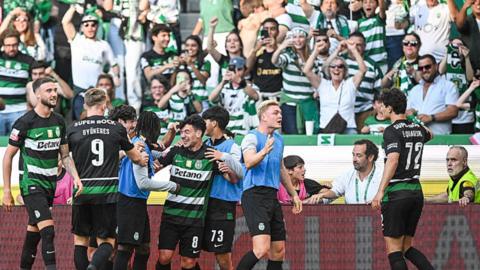 Sporting players celebrate