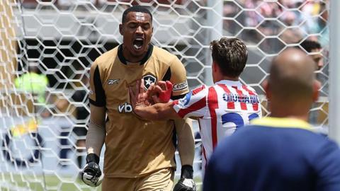 John Victor Maciel Furtado celebrates after making a save against Atletico Madrid.