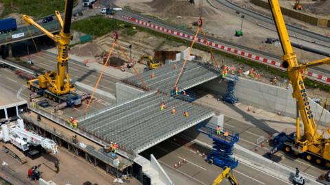 A bridge being installed on the M25