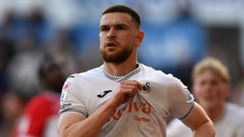 Zan Vipotnik celebrates a Swansea goal 