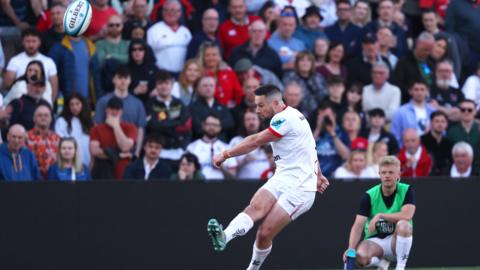 John Cooney kicks the ball