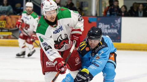 Cardiff Devils' Brandon Estes is challenged by Coventry Blaze's Michael Pelech