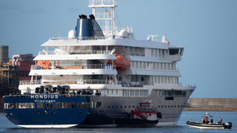 Boats approach the Dutch flagged hantavirus-stricken cruise ship MV Hondius after it arrived at the industrial port of Granadilla de Abona on the island of Tenerife in Spain's Canary Islands on May 10, 2026
