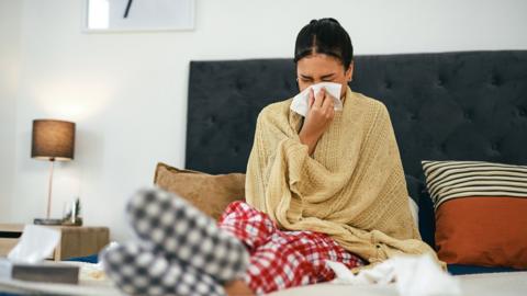 Woman sick in bed