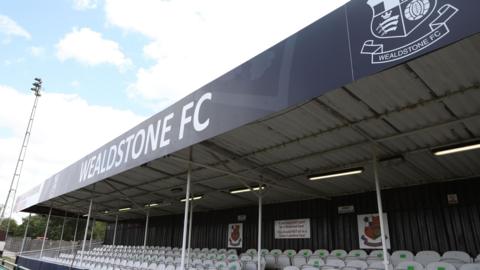 An empty stand at Grosvenor Vale on a sunny day