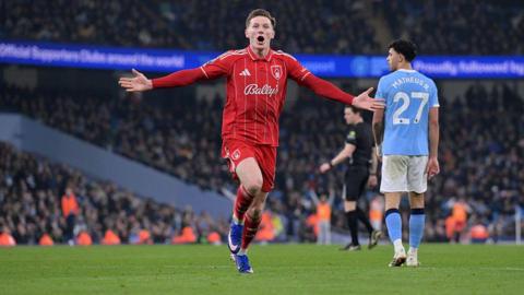 Elliot Anderson celerbates a goal against Manchester City