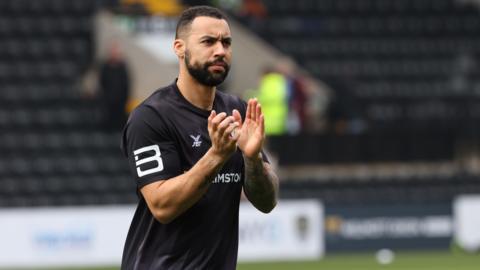 Kane Hemmings pictured before a match, applauding