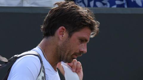 Cameron Norrie trudges off court at Wimbledon