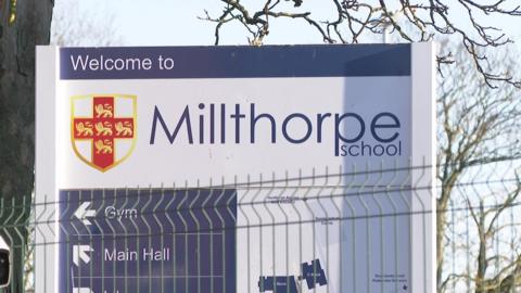 A photo of Millthorpe School's entrance sign