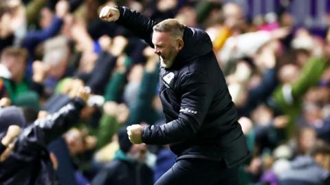 Wayne Rooney jumps for joy as Plymouth score their second goal against Luton