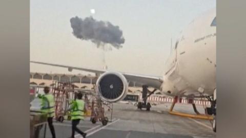 Smoke seen above planes at Dubai International Airport