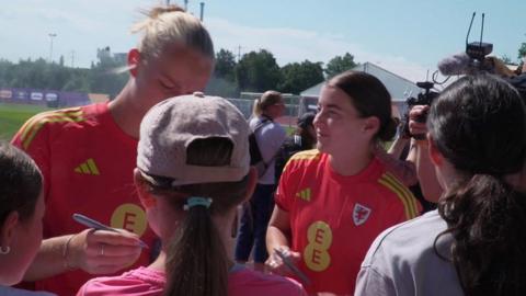 Sophie Ingle and Angharad James sign autographs