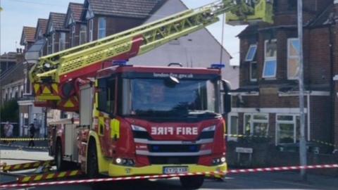 A London Fire Brigade height vehicle parked on a residential road.